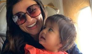 Sushmita Sen poses with a baby on an airplane.(Instagram) Sushmita Sen poses with a baby on an airplane.(Instagram)