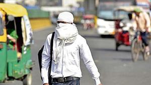 People cover themselves to beat the heat during a hot summer day, in Noida(Photo by Virendra Singh Gosain/ Hindustan Times) People cover themselves to beat the heat during a hot summer day, in Noida(Photo by Virendra Singh Gosain/ Hindustan Times)