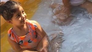 Misha Kapoor with a friend in a kids’ swimming pool. Misha Kapoor with a friend in a kids’ swimming pool.