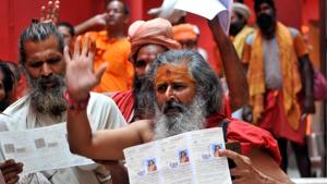 Jammu, India - June 29, 2019: Sadhus wait to get themselves registered for an annual pilgrimage on the first day of registration for Amarnath Yatra at Ram Mandir Base Camp, in Jammu, Jammu and Kashmir, India, on Saturday, June 29, 2019. The 40-day pilgrimage yatra to the cave shrine at an altitude of 3,880 metre in the south Kashmir Himalayas will commence from both the routes from July 1. (Photo by Nitin Kanotra / Hindustan Times) Jammu, India - June 29, 2019: Sadhus wait to get themselves registered for an annual pilgrimage on the first day of registration for Amarnath Yatra at Ram Mandir Base Camp, in Jammu, Jammu and Kashmir, India, on Saturday, June 29, 2019. The 40-day pilgrimage yatra to the cave shrine at an altitude of 3,880 metre in the south Kashmir Himalayas will commence from both the routes from July 1. (Photo by Nitin Kanotra / Hindustan Times)