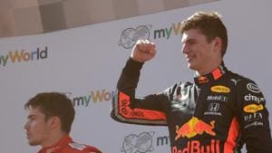 Formula One F1 - Austrian Grand Prix - Red Bull Ring, Spielberg, Austria - June 30, 2019 Red Bull's Max Verstappen celebrates after winning the race as second placed Ferrari's Charles Leclerc looks dejected on the podium(REUTERS) Formula One F1 - Austrian Grand Prix - Red Bull Ring, Spielberg, Austria - June 30, 2019 Red Bull's Max Verstappen celebrates after winning the race as second placed Ferrari's Charles Leclerc looks dejected on the podium(REUTERS)
