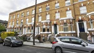 General view of the road in Clapham, south London, Monday July 1, 2019, where the body of a suspected stowaway is believed to have fallen from a passenger plane and was found in a garden, after police attended Sunday following the discovery.(AP File Photo) General view of the road in Clapham, south London, Monday July 1, 2019, where the body of a suspected stowaway is believed to have fallen from a passenger plane and was found in a garden, after police attended Sunday following the discovery.(AP File Photo)