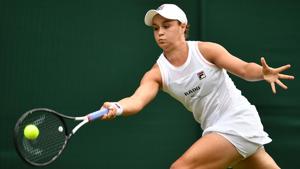 Australia's Ashleigh Barty returns against China's Zheng Saisai during their women's singles first round match on the second day of the 2019 Wimbledon Championships.(AFP) Australia's Ashleigh Barty returns against China's Zheng Saisai during their women's singles first round match on the second day of the 2019 Wimbledon Championships.(AFP)