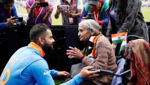 India's Virat Kohli meets India fan, Charu Latta Patel, at the end of the match(Action Images via Reuters) India's Virat Kohli meets India fan, Charu Latta Patel, at the end of the match(Action Images via Reuters)