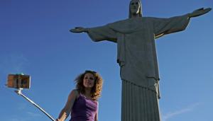 A tourist takes a selfie by the Christ the Redeemer statue(AFP) A tourist takes a selfie by the Christ the Redeemer statue(AFP)