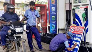 A fuel station attendant fills out the prices on board, in Guwahati, Friday, July 5, 2019. Petrol price will be hiked by over Rs 2.5 per litre and diesel by more than Rs 2.3 after Finance Minister Nirmala Sitharaman today raised taxes on the fuels to part-fund her Budget for 2019-20.(PTI Photo) A fuel station attendant fills out the prices on board, in Guwahati, Friday, July 5, 2019. Petrol price will be hiked by over Rs 2.5 per litre and diesel by more than Rs 2.3 after Finance Minister Nirmala Sitharaman today raised taxes on the fuels to part-fund her Budget for 2019-20.(PTI Photo)