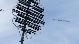 A light aircraft tows a banner with political charged message.(AFP) A light aircraft tows a banner with political charged message.(AFP)