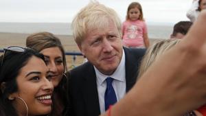 People take selfies with Conservative Party leadership candidate Boris Johnson, in Barry Island, Wales.(AP) People take selfies with Conservative Party leadership candidate Boris Johnson, in Barry Island, Wales.(AP)