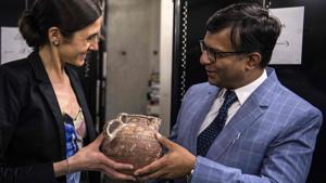 French Customs official Anne-Sophie Vitoux (L) hands over an artifact to a Pakistani embassy official at the Customs department at Roissy airport outside Paris.(AFP) French Customs official Anne-Sophie Vitoux (L) hands over an artifact to a Pakistani embassy official at the Customs department at Roissy airport outside Paris.(AFP)