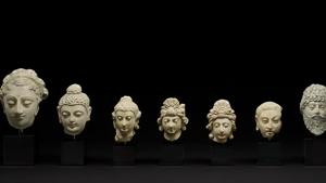 The items include a portrayal of Buddha, the turbaned heads of meditating Bodhisattvas, the bald head of a monk and three larger heads belonging to female and male individuals, one possibly to be identified with Vajrapani, the spiritual guide of Buddha, and the others perhaps lay donors or Bodhisattvas.(Trustees of the British Museum.) The items include a portrayal of Buddha, the turbaned heads of meditating Bodhisattvas, the bald head of a monk and three larger heads belonging to female and male individuals, one possibly to be identified with Vajrapani, the spiritual guide of Buddha, and the others perhaps lay donors or Bodhisattvas.(Trustees of the British Museum.)