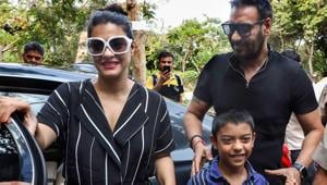 Ajay Devgn and wife-actor Kajol with son Yug arrive to cast their votes at a polling station.(PTI)