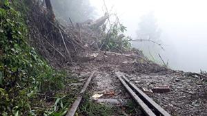 Darjeeling Himalayan Railway suspended Toy train services between NJP to Darjeeling as landslides damaged the railway truck near Tindharia on Wednesday.(ANI Photo) Darjeeling Himalayan Railway suspended Toy train services between NJP to Darjeeling as landslides damaged the railway truck near Tindharia on Wednesday.(ANI Photo)
