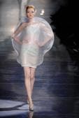 In 2010, Giorgio Armani’s spring couture collection was luminescent and all about the moon. The models showcased shimmering gowns, orb-like outfits, and black jackets with crescent lapels, all in materials with a sheen as if moonbeams were reflecting off them.(Alamy Stock Photo) In 2010, Giorgio Armani’s spring couture collection was luminescent and all about the moon. The models showcased shimmering gowns, orb-like outfits, and black jackets with crescent lapels, all in materials with a sheen as if moonbeams were reflecting off them.(Alamy Stock Photo)