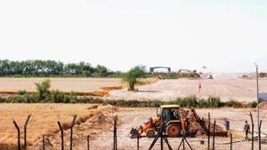 Heavy machines at work beyond the border fence for the construction of the Indian side of Kartarpur corridor, in Gurdaspur district. India is building a four-lane highway on the Indian side. It connects to the zero point of the corridor up to NH 354.(PTI) Heavy machines at work beyond the border fence for the construction of the Indian side of Kartarpur corridor, in Gurdaspur district. India is building a four-lane highway on the Indian side. It connects to the zero point of the corridor up to NH 354.(PTI)
