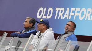 Indian team coaching staff, from left, assistant coach Sanjay Bangar, head coach Ravi Shastri and bowling coach Bharat Arun stand outside their dressing room before the Cricket World Cup semi-final match between India and New Zealand was suspended for the day due to rains at Old Trafford in Manchester, England, Tuesday, July 9, 2019.(AP) Indian team coaching staff, from left, assistant coach Sanjay Bangar, head coach Ravi Shastri and bowling coach Bharat Arun stand outside their dressing room before the Cricket World Cup semi-final match between India and New Zealand was suspended for the day due to rains at Old Trafford in Manchester, England, Tuesday, July 9, 2019.(AP)
