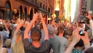 People evacuated from a Carnegie Hall concert during a blackout due to widespread power outages in the Manhattan borough of New York City, U.S, listen to the choir singing on the street in this still frame obtained via social media video July 13, 2019. BRIALLEN HOPPER via REUTERS(BRIALLEN HOPPER) People evacuated from a Carnegie Hall concert during a blackout due to widespread power outages in the Manhattan borough of New York City, U.S, listen to the choir singing on the street in this still frame obtained via social media video July 13, 2019. BRIALLEN HOPPER via REUTERS(BRIALLEN HOPPER)