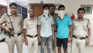 The two suspects after being arrested by the police.(Sourced) The two suspects after being arrested by the police.(Sourced)