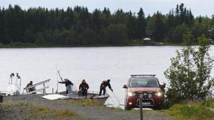 Emergency services attend the accident site at a small harbor at Ume river, outside Umea, Sweden, Sunday July 14, 2019. Swedish officials say a small plane carrying parachutists crashed in northern Sweden and all nine of the people on board were killed. (Samuel Pettersson/TT via AP)(AP) Emergency services attend the accident site at a small harbor at Ume river, outside Umea, Sweden, Sunday July 14, 2019. Swedish officials say a small plane carrying parachutists crashed in northern Sweden and all nine of the people on board were killed. (Samuel Pettersson/TT via AP)(AP)