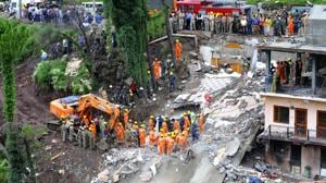NDRF personnel removing debris after a building collapsed at Kumarhatti-Nahan road in Solan, Sunday, July 15, 2019.(Anil Dayal / HT Photo) NDRF personnel removing debris after a building collapsed at Kumarhatti-Nahan road in Solan, Sunday, July 15, 2019.(Anil Dayal / HT Photo)