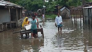 People wade through flood waters in Araria, Bihar, on Sunday, July 14, 2019.(HT Photo) People wade through flood waters in Araria, Bihar, on Sunday, July 14, 2019.(HT Photo)