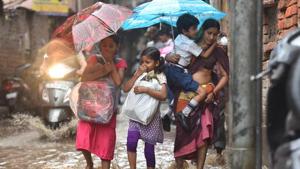 School children on a waterlogged road in Delhi’s Patel Nagar on Wednesday.(Sanchit Khanna/HT Photo) School children on a waterlogged road in Delhi’s Patel Nagar on Wednesday.(Sanchit Khanna/HT Photo)