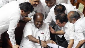 Chief Minister of Karnataka HD Kumaraswamy in conversation with other members during the trust motion debate at Vidhana Soudha in Bengaluru on Thursday.(ANI photo) Chief Minister of Karnataka HD Kumaraswamy in conversation with other members during the trust motion debate at Vidhana Soudha in Bengaluru on Thursday.(ANI photo)