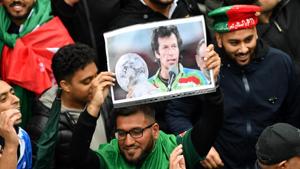 A Pakistan fan holds up a picture of Pakistani Prime Minister Imran Khan.(AFP) A Pakistan fan holds up a picture of Pakistani Prime Minister Imran Khan.(AFP)