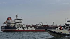 A speedboat and a helicopter of the Iran's Revolutionary Guard move around a British-flagged oil tanker Stena Impero which was seized on Friday by the Guard, in the Iranian port of Bandar Abbas, Sunday, July 21, 2019.(AP) A speedboat and a helicopter of the Iran's Revolutionary Guard move around a British-flagged oil tanker Stena Impero which was seized on Friday by the Guard, in the Iranian port of Bandar Abbas, Sunday, July 21, 2019.(AP)