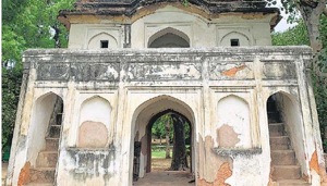 The centuries-old Mughal-era building is believed to be the remains of a gateway that once led to a garden, now nowhere to be found. It nowadays faces an orchard of English roses.(HT Photo) The centuries-old Mughal-era building is believed to be the remains of a gateway that once led to a garden, now nowhere to be found. It nowadays faces an orchard of English roses.(HT Photo)