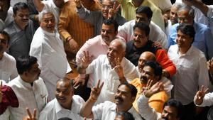 Karnataka Bharatiya Janatha Party (BJP) leaders along with the party president B.S. Yediyurappa flash the victory sign after they were voted out of the ruling coalition government through a trust vote at the Vidhana Soudha, in Bangalore on July 23, 2019.(AFP photo) Karnataka Bharatiya Janatha Party (BJP) leaders along with the party president B.S. Yediyurappa flash the victory sign after they were voted out of the ruling coalition government through a trust vote at the Vidhana Soudha, in Bangalore on July 23, 2019.(AFP photo)