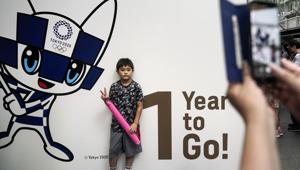 A boy pauses for photos during a One Year to Go ceremony held at Tokyo International Forum.(AP) A boy pauses for photos during a One Year to Go ceremony held at Tokyo International Forum.(AP)