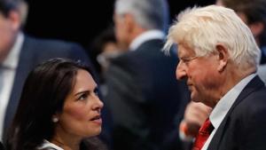 Conservative MP Priti Patel (L) talks with Stanley Johnson (R), father of Conservative MP Boris Johnson, at an event to announce the winner of the Conservative Party leadership contest in central London.(AFP) Conservative MP Priti Patel (L) talks with Stanley Johnson (R), father of Conservative MP Boris Johnson, at an event to announce the winner of the Conservative Party leadership contest in central London.(AFP)