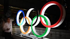 A man walks in front of the Olympic Rings displayed in the Tokyo's Nihonbashi district.(AFP) A man walks in front of the Olympic Rings displayed in the Tokyo's Nihonbashi district.(AFP)