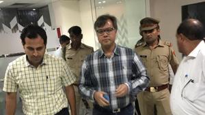 The Noida administration’s move to arrest Ashish Gupta (in centre, wearing specs) comes a month after the Noida authority asked it to recover the land dues.(HT Photo) The Noida administration’s move to arrest Ashish Gupta (in centre, wearing specs) comes a month after the Noida authority asked it to recover the land dues.(HT Photo)