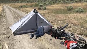 The 73-year-old man who was stranded in the remote Oregon high desert for four days with his two dogs was rescued when a long-distance mountain biker discovered him near death on a dirt road.(AP) The 73-year-old man who was stranded in the remote Oregon high desert for four days with his two dogs was rescued when a long-distance mountain biker discovered him near death on a dirt road.(AP)