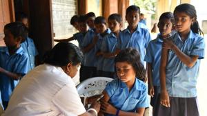 A health worker gives the measles and rubella vaccine to a student at a government school, Assam, September 4, 2018. The drive to eliminate the diseases has gathered momentum.(AFP Photo) A health worker gives the measles and rubella vaccine to a student at a government school, Assam, September 4, 2018. The drive to eliminate the diseases has gathered momentum.(AFP Photo)