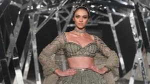India Couture Week 2019: With a panoply of larger-than-life gowns with sweeping trails, designers Falguni Shane Peacock unravelled a breathtaking show at the ongoing India Couture Week.(HTBS/Raajessh Kashyap)