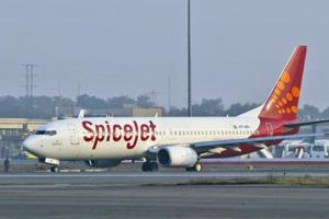 Two pilots of the SpiceJet flight to Mumbai that overshot the runway with 160 passengers and was stuck in the ground for four days have been banned from flying for the next one year.(AP Photo) Two pilots of the SpiceJet flight to Mumbai that overshot the runway with 160 passengers and was stuck in the ground for four days have been banned from flying for the next one year.(AP Photo)