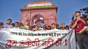 Supporters gathered for a silent protest in solidarity with the Unnao rape case victim, at India Gate in New Delhi on Monday.(Burhaan Kinu/HT) Supporters gathered for a silent protest in solidarity with the Unnao rape case victim, at India Gate in New Delhi on Monday.(Burhaan Kinu/HT)