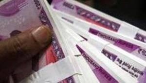 The rupee opened on a weak note and declined by 4 paise to 68.79 against the US dollar in opening trade on Tuesday, amid sustained foreign fund outflows and rising crude oil prices.(REUTERS) The rupee opened on a weak note and declined by 4 paise to 68.79 against the US dollar in opening trade on Tuesday, amid sustained foreign fund outflows and rising crude oil prices.(REUTERS)