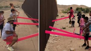 Children and adults play on pink seesaws, installed by Ronald Rael to symbolically bridge the divide and encourage both children and adults to play, along the U.S.-Mexico border in Sunland Park, New Mexico, US.(RAEL SAN FRATELLO via REUTERS) Children and adults play on pink seesaws, installed by Ronald Rael to symbolically bridge the divide and encourage both children and adults to play, along the U.S.-Mexico border in Sunland Park, New Mexico, US.(RAEL SAN FRATELLO via REUTERS)
