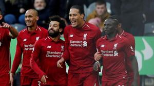 FILE PHOTO of Liverpool's Virgil van Dijk celebrating with Mohamed Salah, Sadio Mane and team mates.(Action Images via Reuters) FILE PHOTO of Liverpool's Virgil van Dijk celebrating with Mohamed Salah, Sadio Mane and team mates.(Action Images via Reuters)