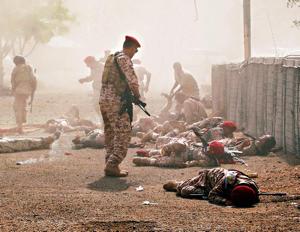 Soldiers lie on the ground after a missile attack on a military parade during a graduation ceremony for newly recruited troopers in Aden, Yemen(Reuters) Soldiers lie on the ground after a missile attack on a military parade during a graduation ceremony for newly recruited troopers in Aden, Yemen(Reuters)