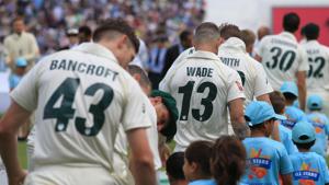 Austalia's player lead out mascots with numbers and names on the back of their shirts.(AFP) Austalia's player lead out mascots with numbers and names on the back of their shirts.(AFP)