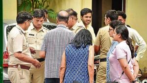 Family members of 72-year-old Indra Khanna wait for her mortal remains outside the mortuary at old MG road near city police station in Gurugram on Saturday. Family members of 72-year-old Indra Khanna wait for her mortal remains outside the mortuary at old MG road near city police station in Gurugram on Saturday.