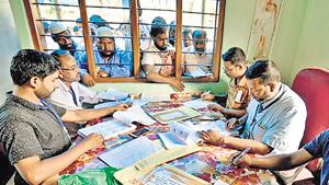 People wait to check their names on the draft list at the National Register of Citizens (NRC) centre at a village in Nagaon district.(REUTERS FILE PHOTO) People wait to check their names on the draft list at the National Register of Citizens (NRC) centre at a village in Nagaon district.(REUTERS FILE PHOTO)