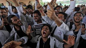 Medical students shout slogans during a protest against National Medical Commission (NMC) Bill, which they say will result in deterioration of medical studies and services, in New Delhi.(REUTERS) Medical students shout slogans during a protest against National Medical Commission (NMC) Bill, which they say will result in deterioration of medical studies and services, in New Delhi.(REUTERS)