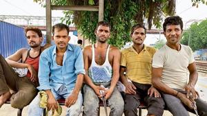 Five migrant labourers share the secret of de-stressing at day’s end(HT Photo) Five migrant labourers share the secret of de-stressing at day’s end(HT Photo)
