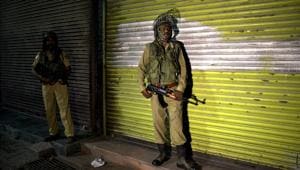 Soldiers stand guard in Srinagar, August 4, 2019(AP) Soldiers stand guard in Srinagar, August 4, 2019(AP)