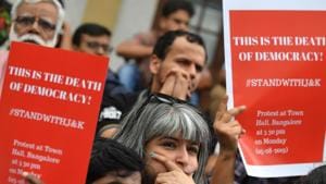 Protestors and activists belonging to the Alternative Law Forum and other left wing organisations take part in a protest in reaction to the government scrapping Article 370 that granted a special status to Jammu and Kashmir.(AFP Photo) Protestors and activists belonging to the Alternative Law Forum and other left wing organisations take part in a protest in reaction to the government scrapping Article 370 that granted a special status to Jammu and Kashmir.(AFP Photo)